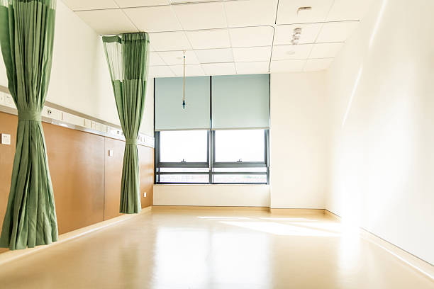 Empty hospital ward Interior with medical equipment and curtains