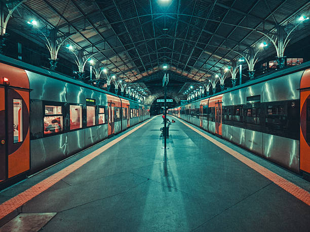 View of a symmetrical empty metro station platform.