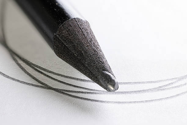 pencils with black lead on blue corrugated paper, several monochrome pencils for sketches or graphic work are in a row.