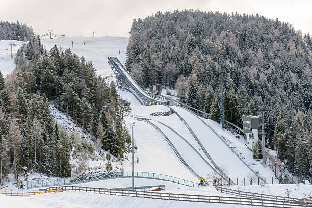 Ski jumping ramp in a mountain resort on a cloudy winter day. Seefeld, Austria.