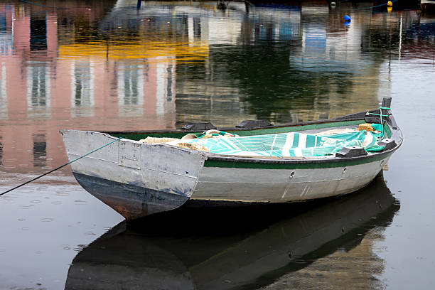 Wooden boats on a channel of Mediterranean sea in the centre of old town (medina) during a winter day. Bizerte, Tunisia, Africa.
