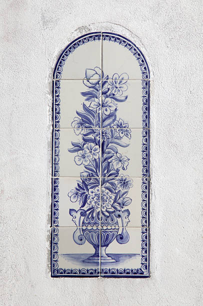 The artwork shows a tall vase filled with flowers, detailed in blue and white tiles.