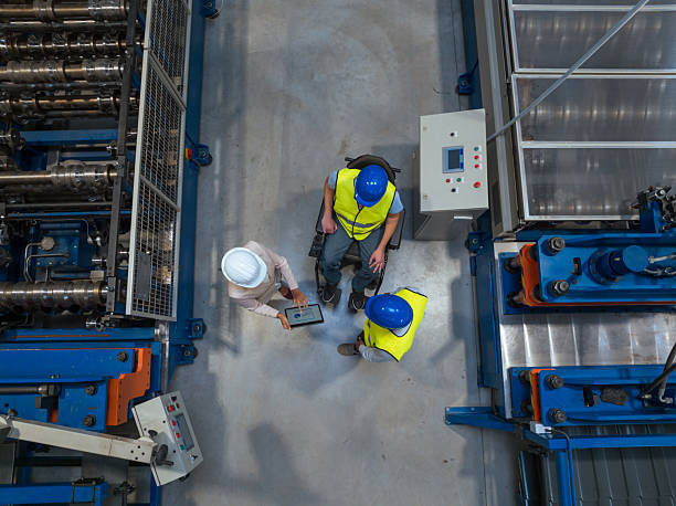 istock Manager oversees workers in modern manufacturing, fostering teamwork 2255912493