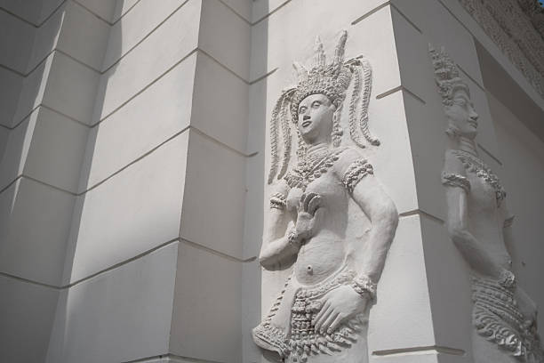 Angel apsara emboss art on the white wall