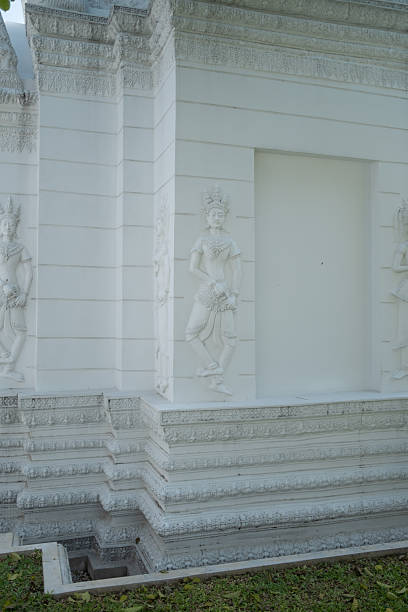 Angel apsara emboss art on the white wall