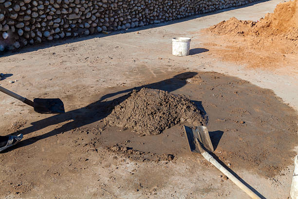 Wet mixing a cement on floor for applying construction