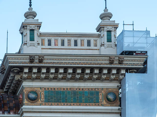 Palazzo delle Terme Berzieri facade showcasing intricate Liberty style and Art Nouveau architecture, featuring ornate friezes, detailed carvings, and decorative ceramic panels under a clear sky
