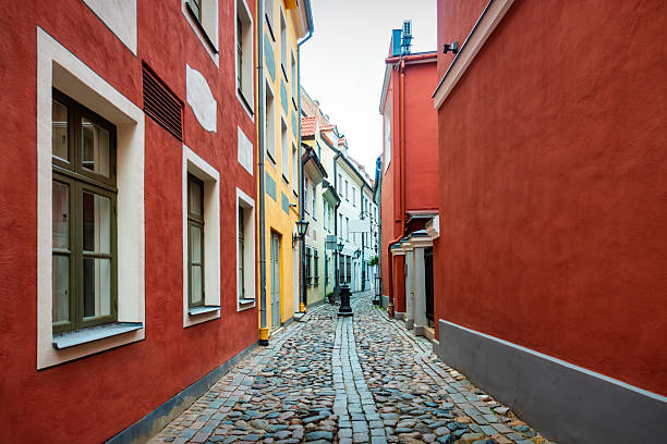 Alley with colorful buildings in Old Town Riga, Latvia.