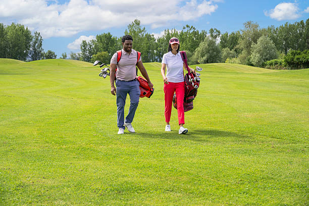 istock Multiracial Couple Playing Golf In The Course 2255932124