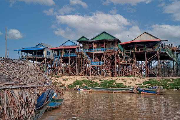 Cambodian little girl rowing a boat on Tonle Sap, Cambodia