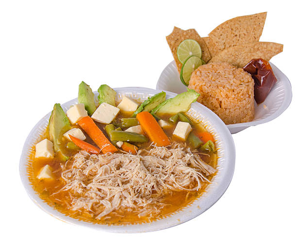 Delicious Mexican soup with chicken, avocado, and tortilla chips
