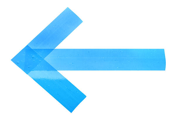 Arrow made of light blue adhesive tape on white background, top view