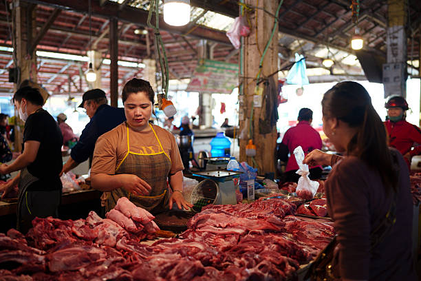Pai, Vietnam - May, 7, 2024: Meat market stall in Pai. Fresh food is produced locally, keeping the economy running. Market stalls can be found all around Vietnam.
