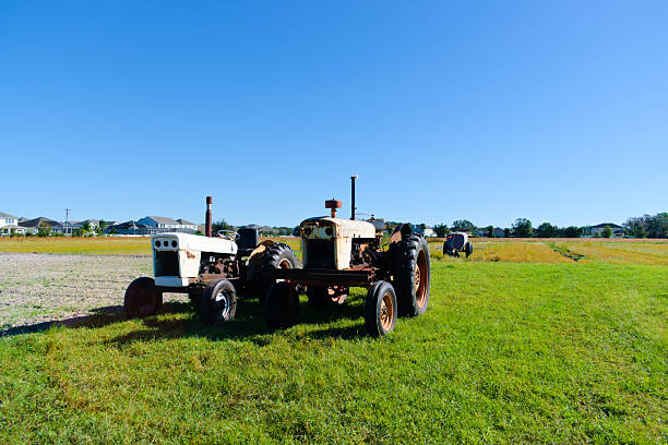 New Smyrna Beach, FL, USA, Nov 22, 2024: Landscape, some rusty old tractors and equipment in the field.
