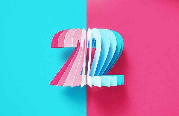Colorful number 2 on blue and pink background.