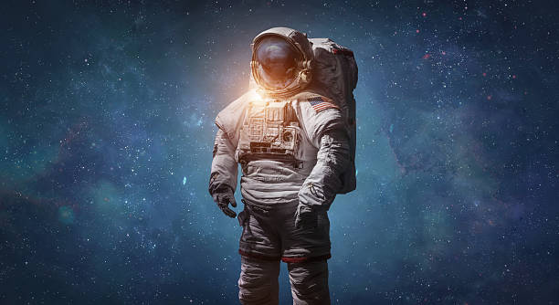 istock Astronaut in outer space with stars. Spaceman in deep space sci-fi wallpaper. Spaceman with starry and galactic background. Mixed media. Photo collage. Not AI 2255968984