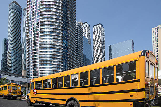 Yellow School bus driving in Miami Florida USA.