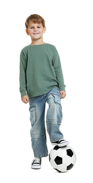 istock Cute boy with soccer ball on white background 2255970595