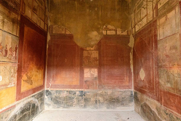 Pompeii, Italy. Ancient Frescoes In Wall Of Old Building.
