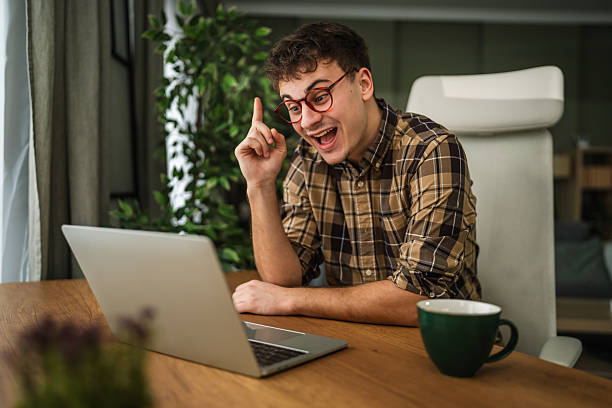 istock Creative man discovering new idea enthusiastically at home office 2255978162