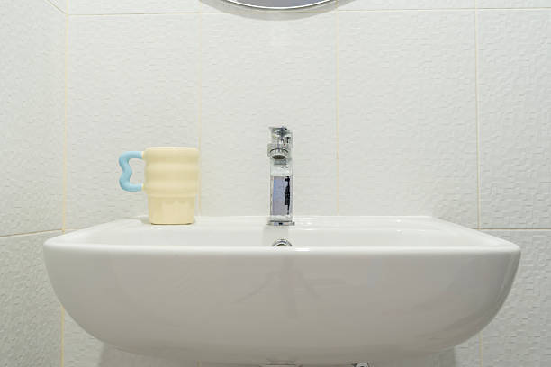 Pure Flow: Crystal Clear Water Streaming from a Faucet