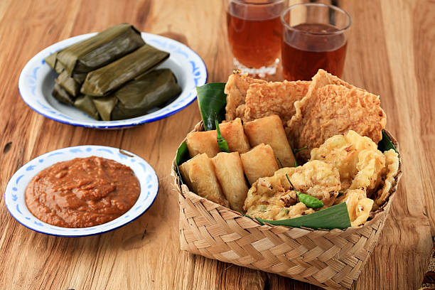 Various Gorengan for Takjil Breaking the Fast with Tea, Lontong and Peanut Sauce