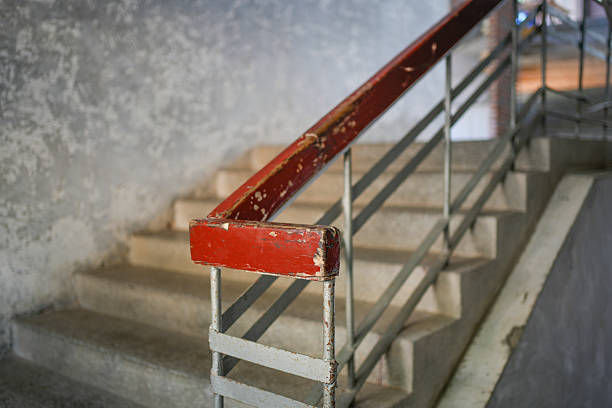 Dazzling red lacquer handrails and concrete stairs - vintage industrial style scene elements
