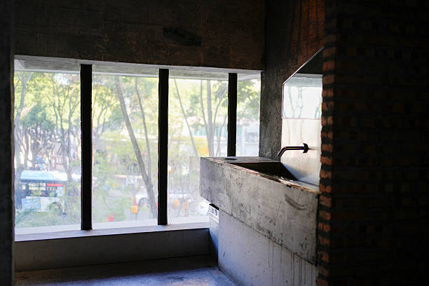 Industrial Bathroom Design: Brick Wall, Concrete Structure, and City View