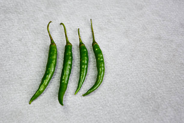 Close up of fresh green chilli peppers