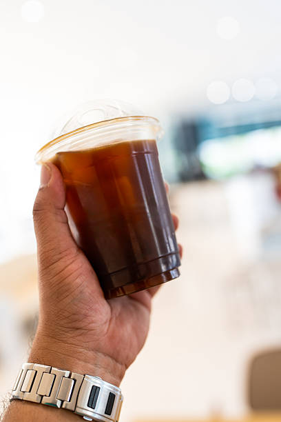 Closeup cold brew iced americano coffee with ice cubes no straw side view