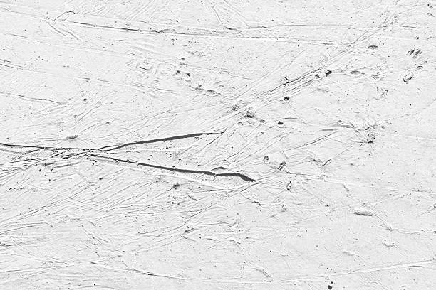 Textured background of white plaster on a concrete wall