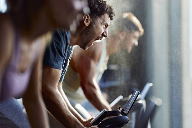 istock Making an effort during stationary cycling class! 2256014594