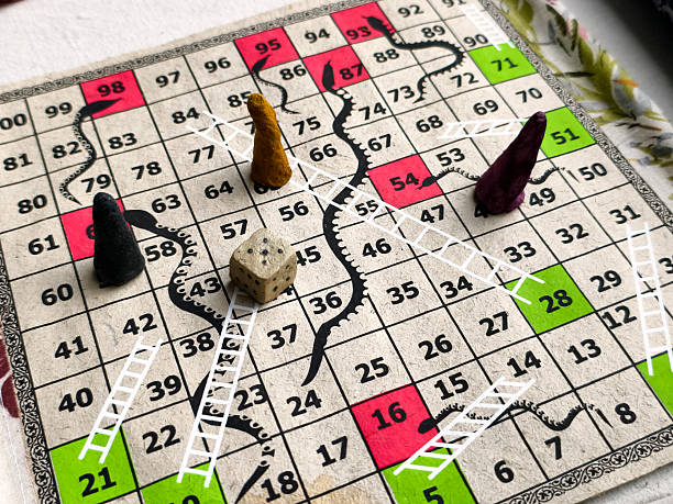 Three game pieces and four dice