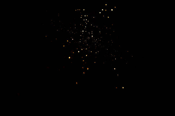 Golden abstract bokeh on black background. Holiday concept