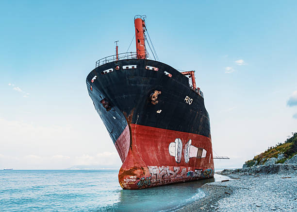 old wrecked sunken ship on the rocky shore of the Arctic Ocean is the end of the road