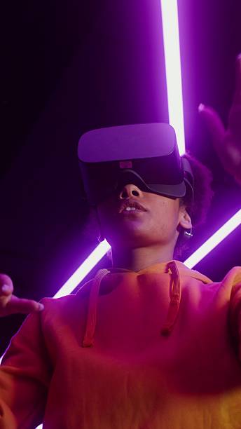 istock A woman in a virtual reality headset plays. 2256030396