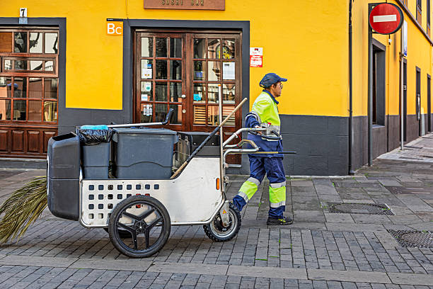 San Cristobal de La Laguna, Tenerife, Spain, Europe - December 15th 2025: A modern street cleaner stands with municipal cleaning equipment in San Cristóbal de La Laguna, the former capital of Tenerife in the Canary Islands and today a UNESCO World Heritage Site. Spanish cities maintain organised teams of municipal street cleaners, contributing to some of the cleanest urban environments in Europe. The scene shows everyday public‑service work in one of the island’s most historically significant cities.