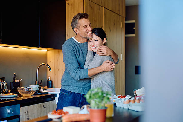 istock Happy couple hugging in modern kitchen 2256034352
