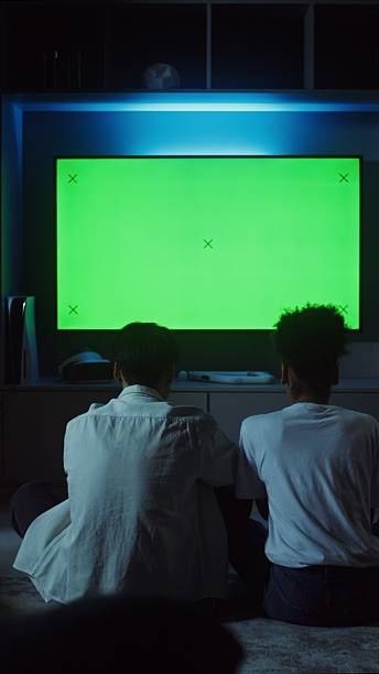 istock Man and woman playing video game while sitting. 2256036088