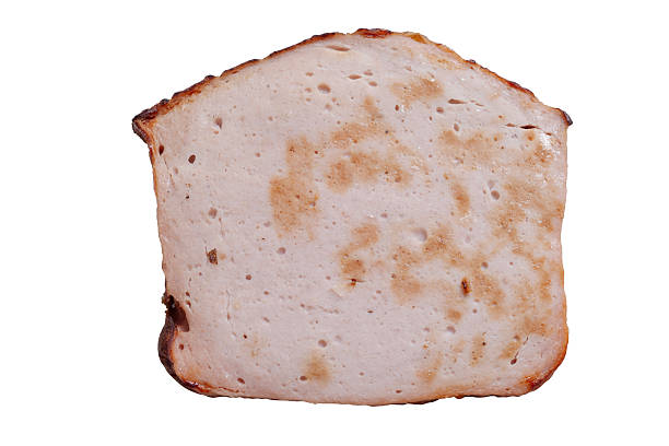 close up of a slice of meatloaf isolated
