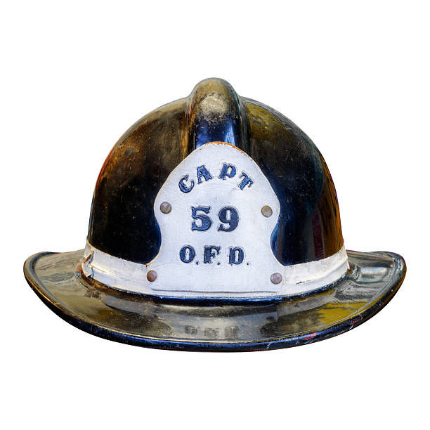 Vintage black captain fire brigade helmet isolated on a white background