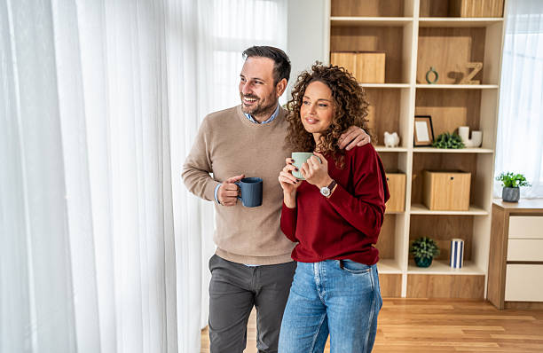 istock Happy couple enjoying coffee together at home 2256060863