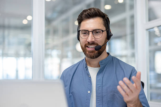 istock Call center agent wearing headset providing customer support 2256063443