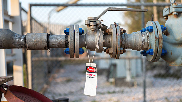 istock An isolation tag on oil production pipeline ball valve. 2256065559