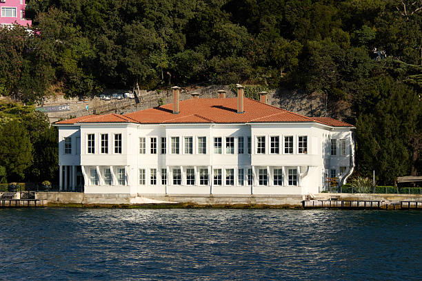 Istanbul, Turkey-January 24, 2026: A majestic white wooden Ottoman-style waterfront mansion, known as a \