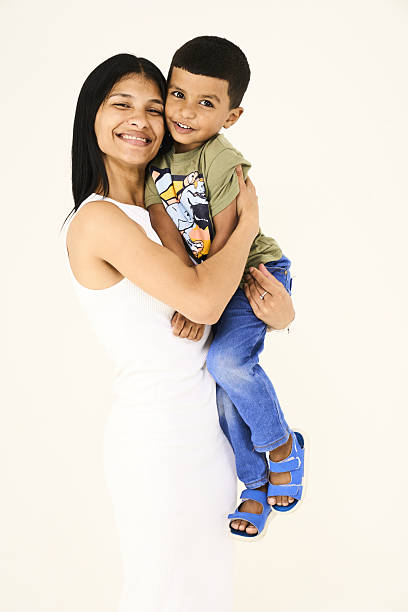 single mother and her jofyul son together in the studio