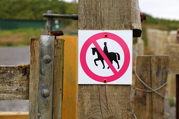 Horse riding prohibited sign on a hiking trail in Benbulben forest in County Sligo in Ireland.