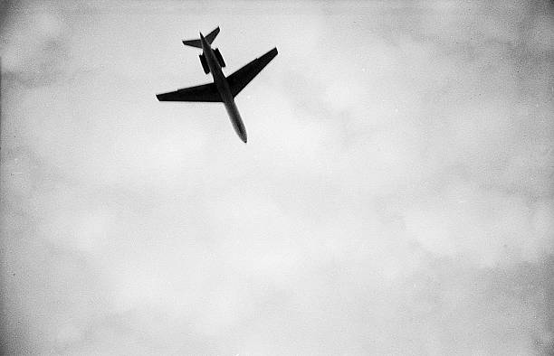 Genoa, Italy, - September 5, 1978: view from below on silhouette Boeing 727 in sky over Italy