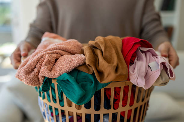 Two laundry baskets full of clothes and sheets to wash. Housework.