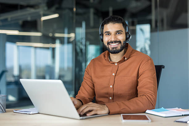 istock Confident indian man wearing headset working in office 2256097541